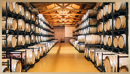 Crush - Racking wine into oak barrels