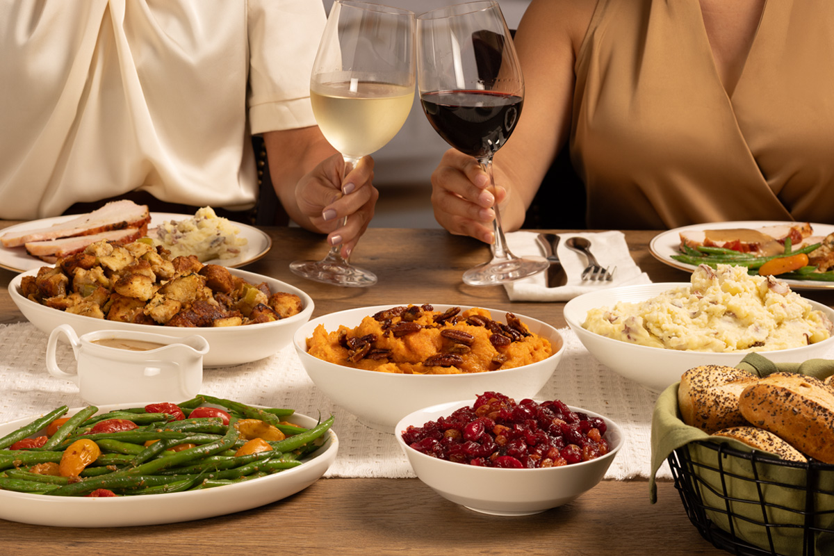 Thanksgiving feast including French green beans, brioche sage stuffing, and sweet potato mash.